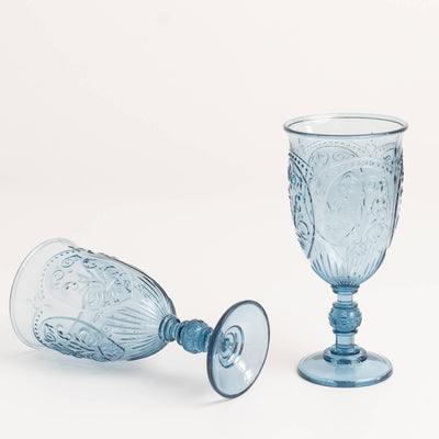 Blue decorative glassware set on a white background.
