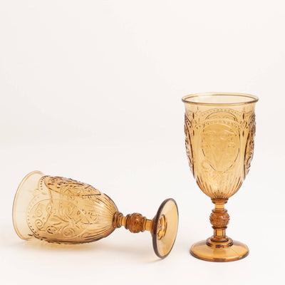 Amber decorative goblets on a white background.