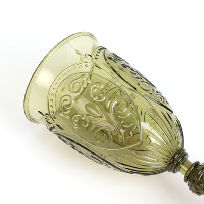 Decorative olive green glass goblet with intricate designs