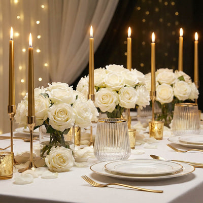 Elegant white rose and gold candle table centerpiece for a luxury event