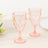Set of two pink crystal goblets with a diamond pattern.