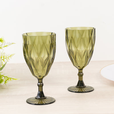 Green decorative glass goblets in a diamond pattern.