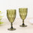 Green decorative glass goblets in a diamond pattern.
