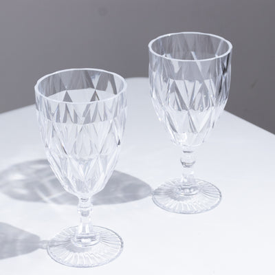 Elegant crystal glasses with diamond cut design.