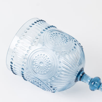 Blue decorative glass goblet with intricate patterns