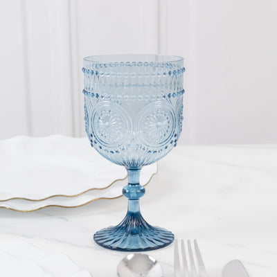 Blue decorative glass goblet on a marble table.