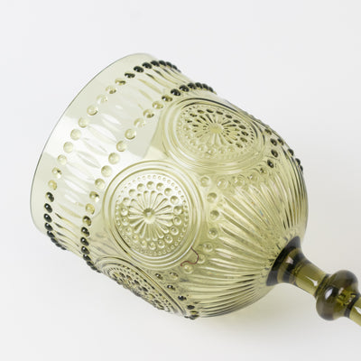 Green decorative glass goblet with intricate patterns