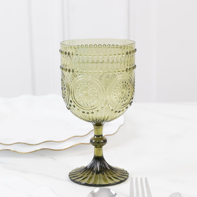 Green vintage glass goblet with intricate design