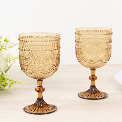 Amber decorative glasses with intricate patterns.