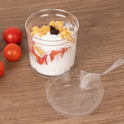 Yogurt parfait with strawberries, granola, and a clear plastic cup