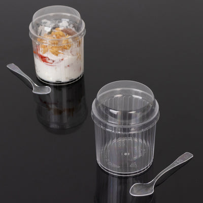 Clear plastic dessert cups with spoons, ideal for serving treats.