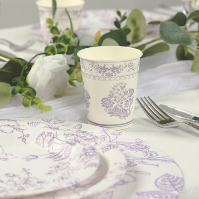 Floral patterned disposable cup on a dining table with elegant tableware.