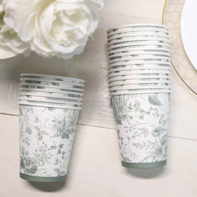 Floral printed paper cups stacked on a light surface.