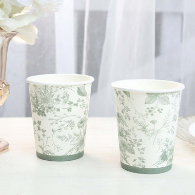 Floral print paper cups on a table with soft background.