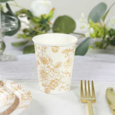 Floral design paper cup on a table with elegant decor elements.