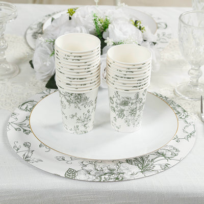 Floral disposable cups stacked on a decorative plate with elegant table setting.