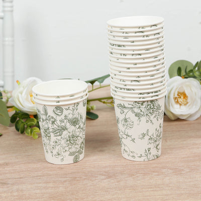 Stack of floral-patterned paper cups on a wooden surface.