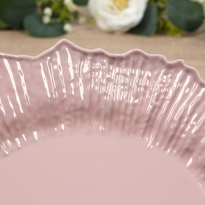 Close-up of a pink decorative plate with textured edges.