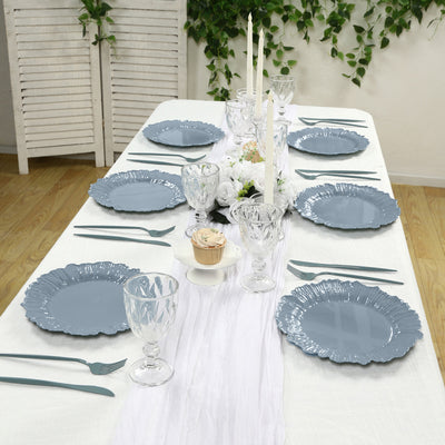 Elegant blue dinner plates set on a beautifully arranged dining table.