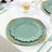 Elegant mint green plate with gold detailing on a beautifully set table.