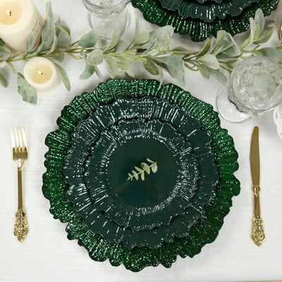 Elegant green decorative plates with a floral design and greenery accent.