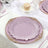 Elegant pink plates with ornate edges styled for a sophisticated table setting.