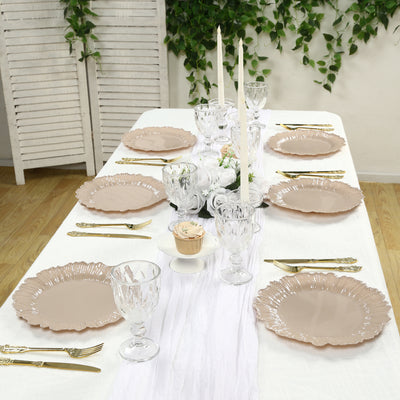 Elegant table setting with pink plates and crystal glassware. Perfect for special occasions.