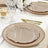 Elegant beige dinner plates with decorative edges on a dining table setting.