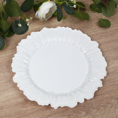 White decorative plate with a scalloped edge design.