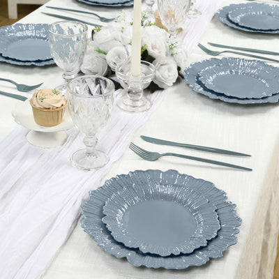 Elegant blue floral dinner plates set on a beautifully arranged dining table.