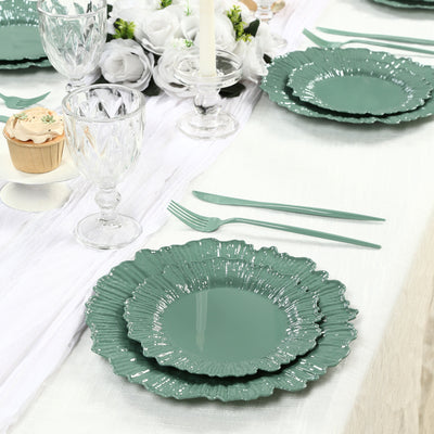 Elegant green floral dinner plates set on a beautifully arranged dining table.