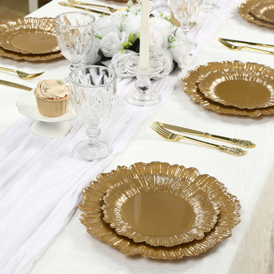 Elegant gold dinnerware set on a beautifully arranged dining table.
