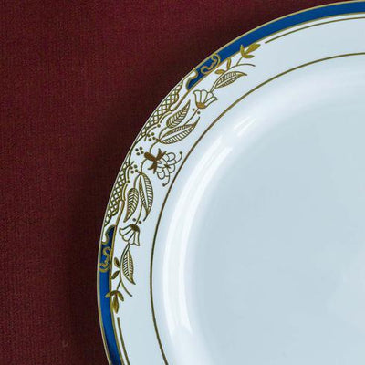 Elegant white plate with blue and gold floral design on rim.