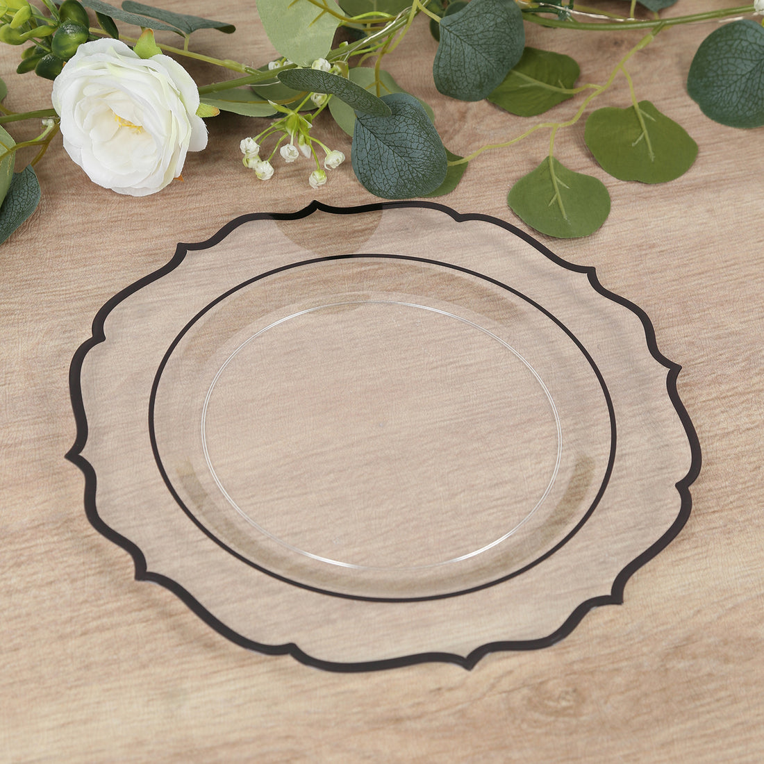Clear decorative plate with black trim on wooden table