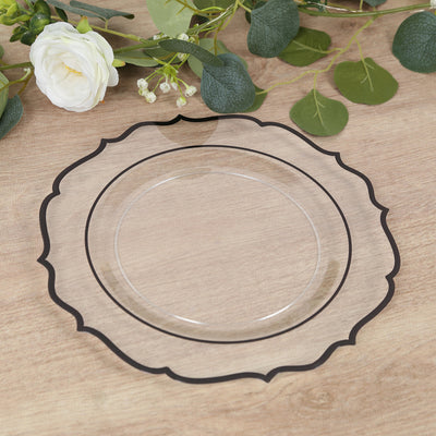 Clear decorative plate with black trim on wooden table