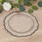 Clear decorative plate with black trim on wooden table