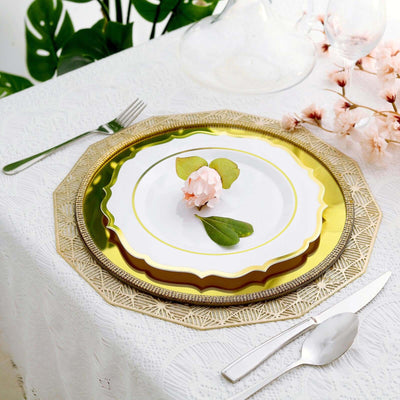 Elegant gold and white dinner plate with floral accent on a table setting.