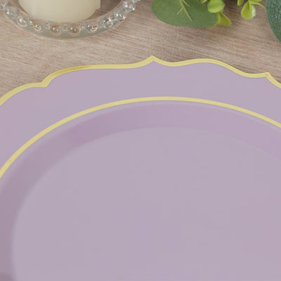 Purple decorative plate with gold trim on a wooden surface.