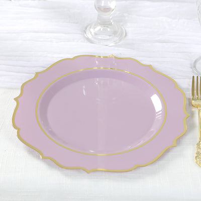 Purple decorative plate with gold trim on a textured white tablecloth.