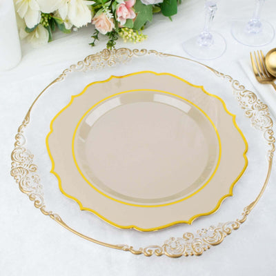 Elegant gold-rimmed dinner plate on a decorative charger with soft floral background.