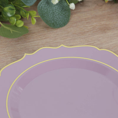 Purple decorative plate with a gold rim on a wooden surface.