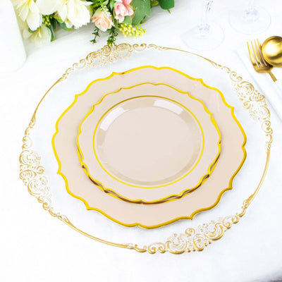 Elegant gold and blush scalloped dinnerware set on a table setting.
