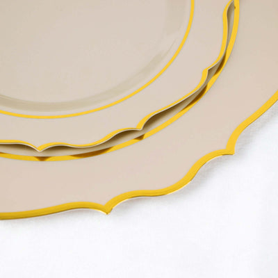 Elegant beige plates with yellow scalloped edges stacked together.