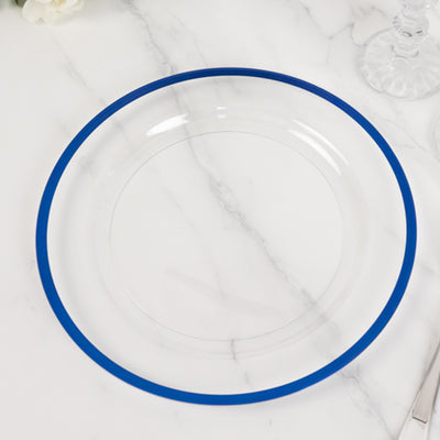 Clear glass plate with blue rim on a marble surface.