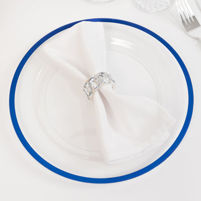 Elegant clear plate with blue rim and white napkin, adorned with a crystal napkin ring.