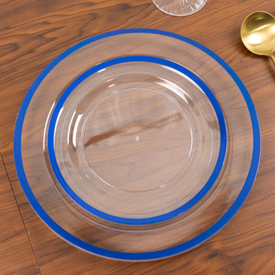 Clear glass plate with blue rim on wooden table.