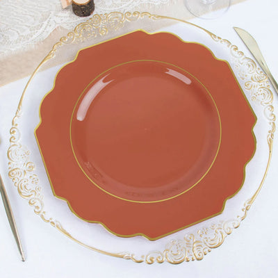 Elegant brown decorative plate with gold trim on a clear glass charger plate.