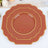 Elegant terracotta plates with gold trim in layered design.