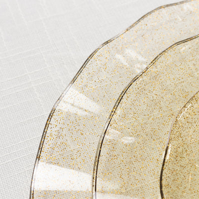 Gold glitter decorative plates on a white background