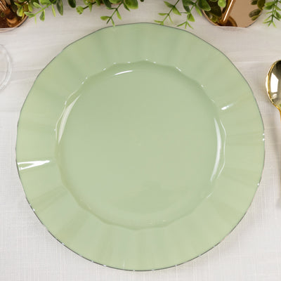 Green decorative plate with a scalloped edge on a textured table surface.